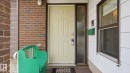 Cream-colored entry door with side light, featuring brick and horizontal siding exterior finishes - 27 Addison Crescent, St. Albert, AB  - Outdoor With Exterior 
