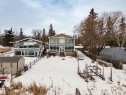 Two-story residential dwelling featuring extensive glass enclosures - 104 Bayview Drive, Rural Parkland County, AB  - Outdoor 