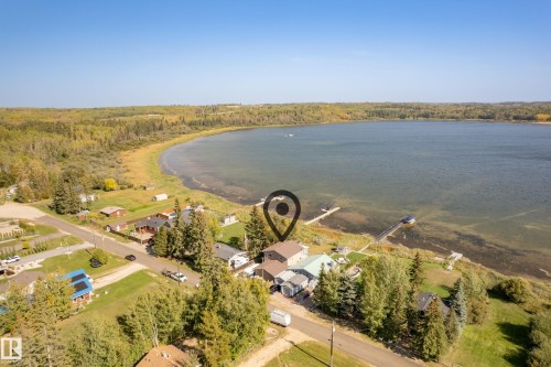 Waterfront property with private dock access and extensive lake frontage - 104 Bayview Drive, Rural Parkland County, AB - Outdoor With Body Of Water With View