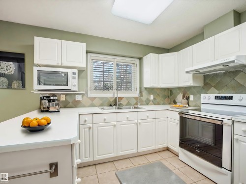 Virtually Staged - 146 Oeming Road, Edmonton, AB - Indoor Photo Showing Kitchen With Double Sink