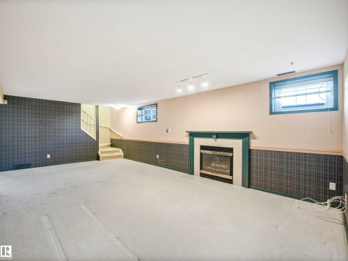 146 Oeming Road, Edmonton, AB - Indoor Photo Showing Basement With Fireplace