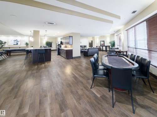 Spacious communal area featuring wood-finish flooring - 135 7825 71 Street, Edmonton, AB - Indoor Photo Showing Dining Room
