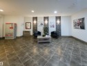 Spacious common area featuring large format tile flooring and white walls - 135 7825 71 Street, Edmonton, AB  - Indoor Photo Showing Other Room 