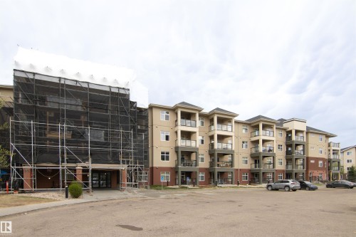 Multi-story residential building featuring balconies with glass railings - 135 7825 71 Street, Edmonton, AB - Outdoor With Facade