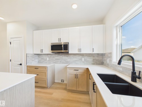 35 Sereno Lane, Fort Saskatchewan, AB - Indoor Photo Showing Kitchen With Double Sink