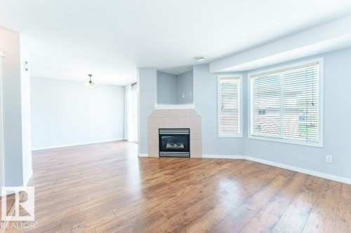 12 2505 42 Street, Edmonton, AB - Indoor Photo Showing Other Room With Fireplace