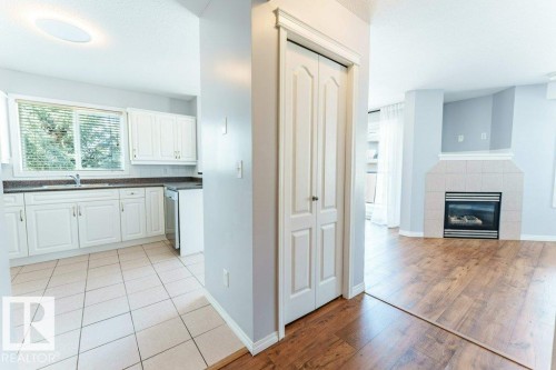 12 2505 42 Street, Edmonton, AB - Indoor Photo Showing Kitchen With Fireplace