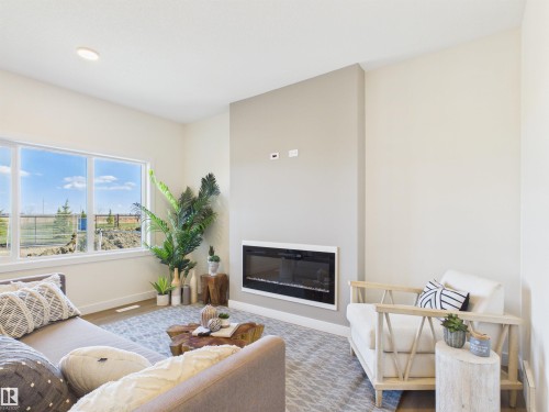 53 Sumac Close, Fort Saskatchewan, AB - Indoor Photo Showing Living Room With Fireplace