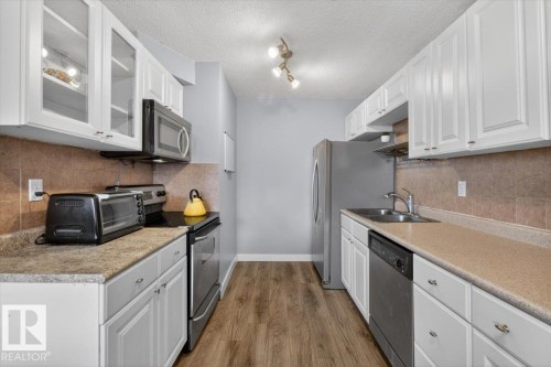 #405 10011 116 St Nw, Edmonton, AB - Indoor Photo Showing Kitchen With Double Sink With Upgraded Kitchen
