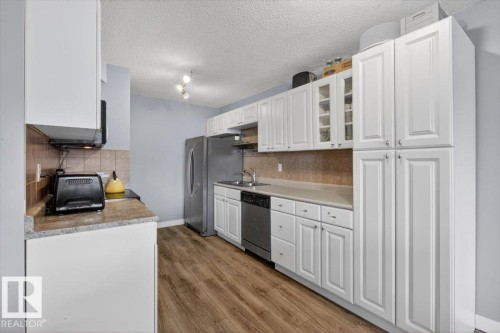 #405 10011 116 St Nw, Edmonton, AB - Indoor Photo Showing Kitchen With Double Sink