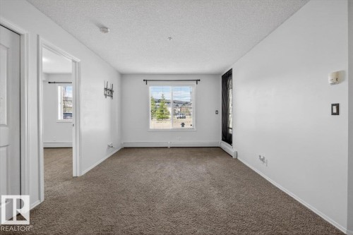 117 12035 22 Av, Edmonton, AB - Indoor Photo Showing Other Room