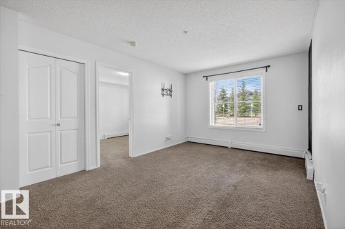 117 12035 22 Av, Edmonton, AB - Indoor Photo Showing Other Room