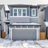 This property presents a modern exterior with varied siding textures and a prominent attached garage - 19635 29 Avenue, Edmonton, AB  - Outdoor 