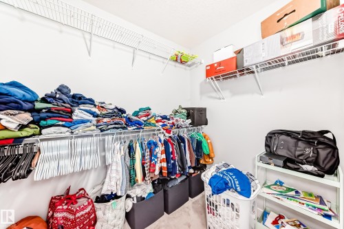 Spacious walk-in closet featuring wire shelving and hanging rods providing ample storage solutions - 19635 29 Avenue, Edmonton, AB - Indoor With Storage