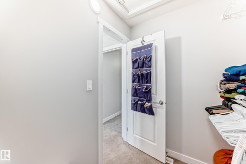 The property features light gray walls, a white interior door, and light-colored carpet - 19635 29 Avenue, Edmonton, AB - Indoor Photo Showing Other Room