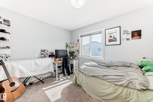 This room features light-colored walls and carpeted flooring, with a window providing natural light - 19635 29 Avenue, Edmonton, AB - Indoor Photo Showing Bedroom