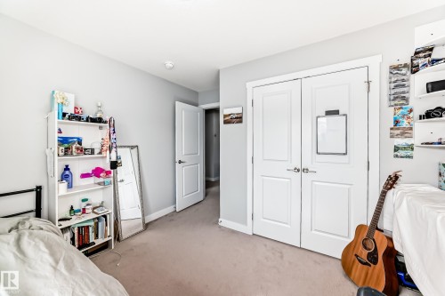 This room features light-toned walls and carpeting, creating a neutral canvas - 19635 29 Avenue, Edmonton, AB - Indoor Photo Showing Bedroom