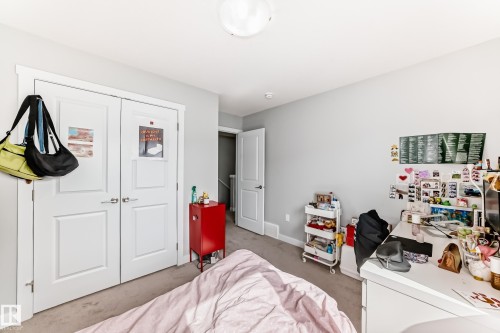 This room features light grey walls and light colored carpeting, creating a neutral backdrop - 19635 29 Avenue, Edmonton, AB - Indoor Photo Showing Bedroom