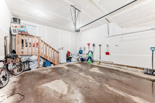 The property includes an attached garage with a concrete floor and white walls - 19635 29 Avenue, Edmonton, AB - Indoor Photo Showing Garage