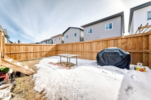 The property features a fenced yard with natural wood privacy fencing - 19635 29 Avenue, Edmonton, AB - Outdoor