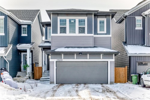 The property features a two-story exterior with a garage and a driveway - 19635 29 Avenue, Edmonton, AB - Outdoor With Facade