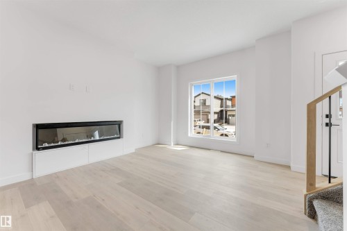 232 24 Street, Edmonton, AB - Indoor Photo Showing Living Room With Fireplace