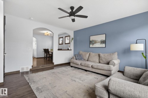 Living area featuring wood-finish flooring and a ceiling fan - 108 Hewitt Circle, Spruce Grove, AB - Indoor Photo Showing Living Room