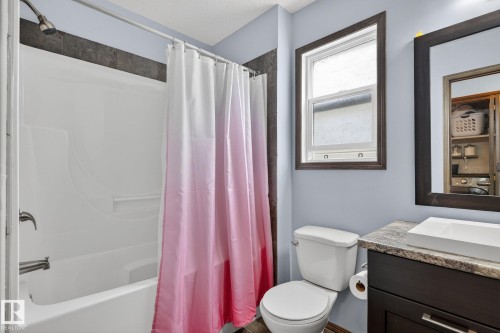 Bathroom featuring a white bathtub/shower combination with chrome fixtures - 108 Hewitt Circle, Spruce Grove, AB - Indoor Photo Showing Bathroom