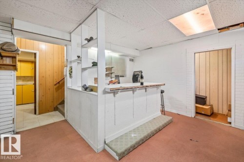 this bar screams happy hour and fun family gatherings - 9732 64 Street, Edmonton, AB - Indoor Photo Showing Other Room