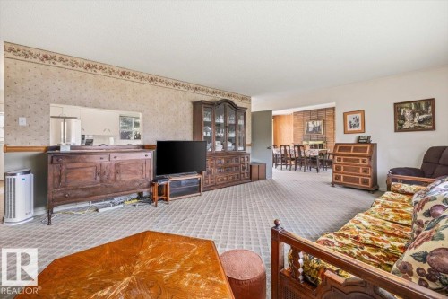 Spacious carpeted living room - 9732 64 Street, Edmonton, AB - Indoor Photo Showing Living Room