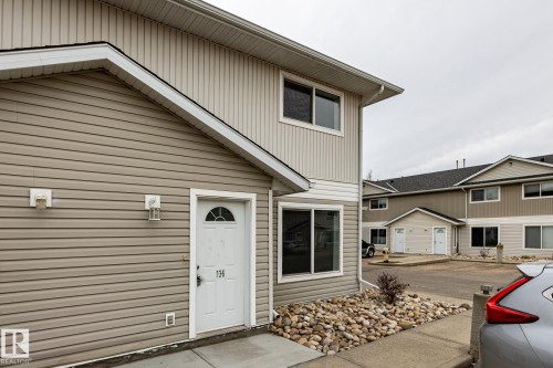 Contemporary exterior featuring horizontal and vertical siding - #136, 180 Bridgeport Bv, Leduc, AB - Outdoor With Exterior