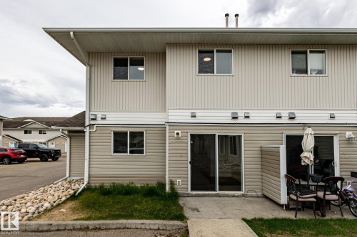 Multi-level exterior with light-toned horizontal and vertical siding - #136, 180 Bridgeport Bv, Leduc, AB - Outdoor With Exterior