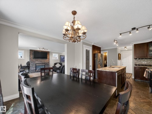 40 English Way, St. Albert, AB - Indoor Photo Showing Dining Room With Fireplace