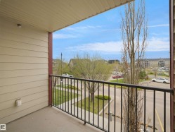 Private balcony featuring a concrete floor and black metal railing - 