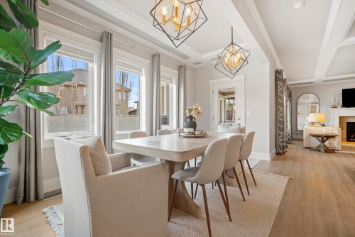 2551 Cameron Ravine Landing, Edmonton, AB - Indoor Photo Showing Dining Room With Fireplace