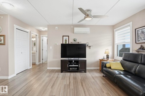 302 4103 50 Street, Beaumont, AB - Indoor Photo Showing Living Room