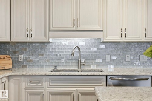 302 4103 50 Street, Beaumont, AB - Indoor Photo Showing Kitchen With Double Sink With Upgraded Kitchen