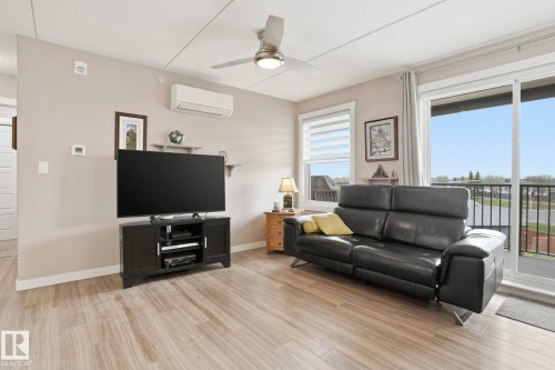 302 4103 50 Street, Beaumont, AB - Indoor Photo Showing Living Room