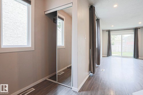 Interior space featuring wood-finish flooring and recessed lighting - 35 Chungo Drive, Devon, AB - Indoor Photo Showing Other Room