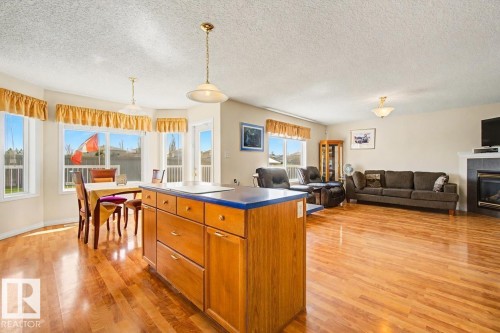 3203 23 Street, Edmonton, AB - Indoor Photo Showing Living Room With Fireplace