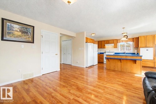 3203 23 Street, Edmonton, AB - Indoor Photo Showing Living Room With Fireplace