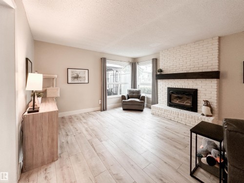 8 Whiteoaks Estates, St. Albert, AB - Indoor Photo Showing Living Room With Fireplace