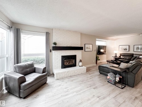 8 Whiteoaks Estates, St. Albert, AB - Indoor Photo Showing Living Room With Fireplace