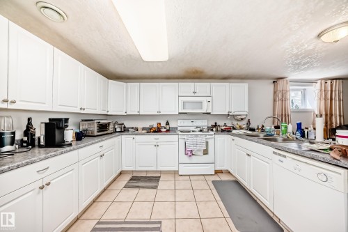 13911 23 Street, Edmonton, AB - Indoor Photo Showing Kitchen With Double Sink