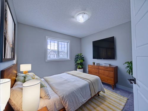 Virtually Staged - 11 165 Cy Becker Boulevard, Edmonton, AB - Indoor Photo Showing Bedroom
