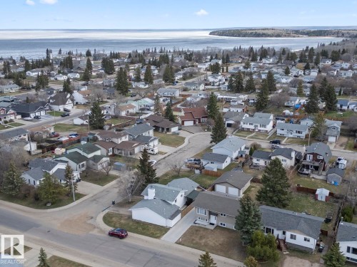 Aerial perspective showcasing a residential neighborhood with varied home styles - 1304 12 Street, Cold Lake, AB - Outdoor With Body Of Water With View
