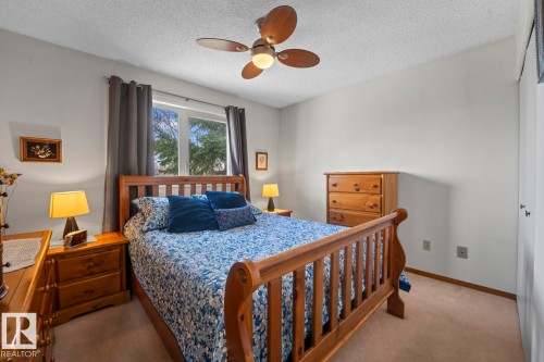 Bright bedroom with neutral wall paint and carpet flooring - 1304 12 Street, Cold Lake, AB - Indoor Photo Showing Bedroom