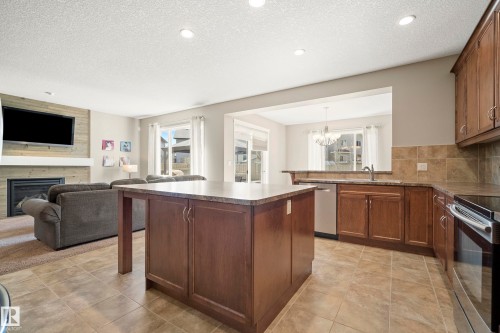 3510 Abbott Close, Edmonton, AB - Indoor Photo Showing Kitchen With Fireplace