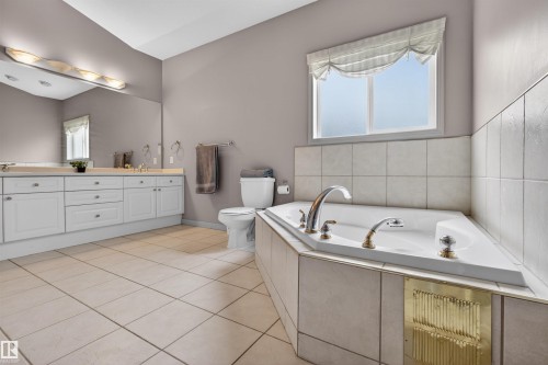 Soaking tub with tile surround - 201 Erin Ridge Drive, St. Albert, AB - Indoor Photo Showing Bathroom