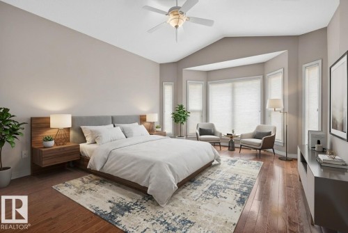 Spacious bedroom featuring wood-finish flooring and vaulted ceilings - 201 Erin Ridge Drive, St. Albert, AB - Indoor Photo Showing Bedroom